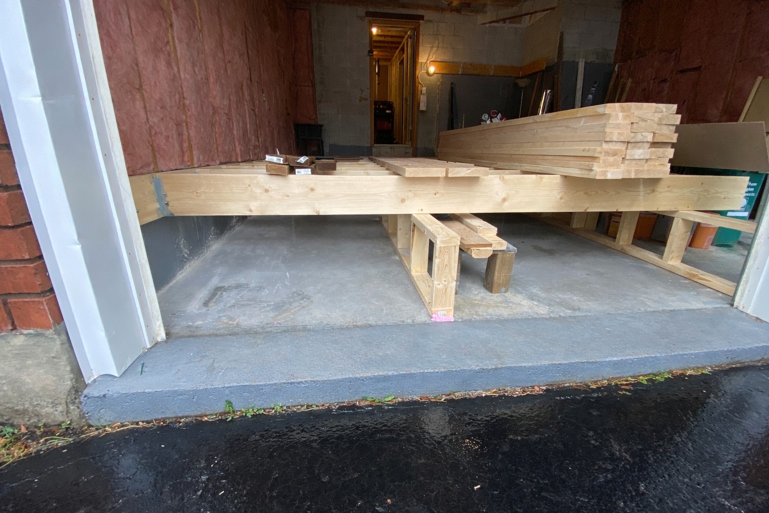 Interior framing and insulation stage of garage conversion ADU in Clarington, Ontario